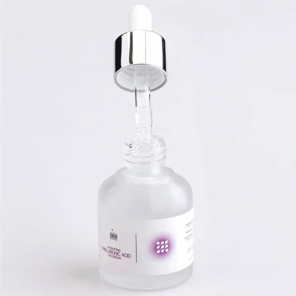 Hyaluronic Acid Serum with open dropper lid against white background