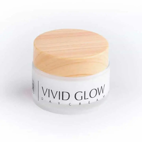 Face Whitening Cream vivid glow is shown with which white background the Face Whitening Cream  lid is in gray color