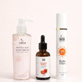 Orior Cosmetics No Filter Glow Bundle featuring a face wash, strawberry serum, and SPF 50 sunscreen bottle.