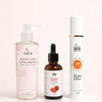 Orior Cosmetics No Filter Glow Bundle featuring a face wash, strawberry serum, and SPF 50 sunscreen bottle.
