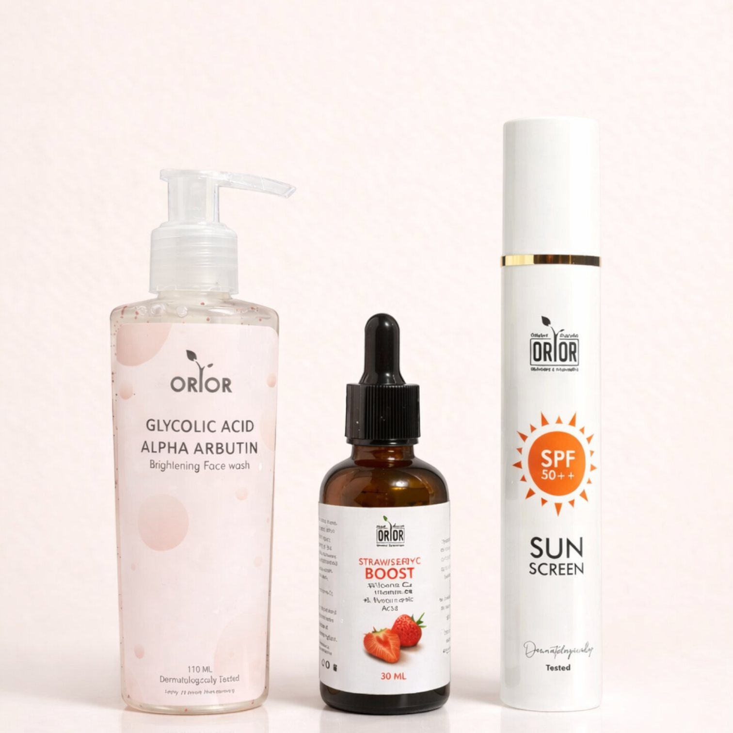 Orior Cosmetics No Filter Glow Bundle featuring a face wash, strawberry serum, and SPF 50 sunscreen bottle.